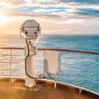 Summer cruise vacation concept. Panoramic view of the sea with a beautiful sunset just above the horizon. | Von Nancy Pauwels